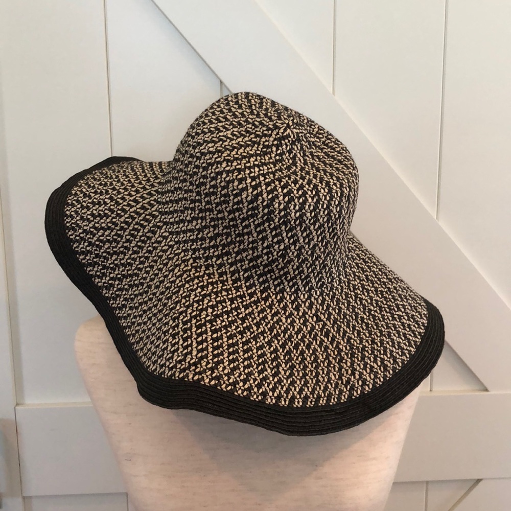 Beige and black floppy beach hat.